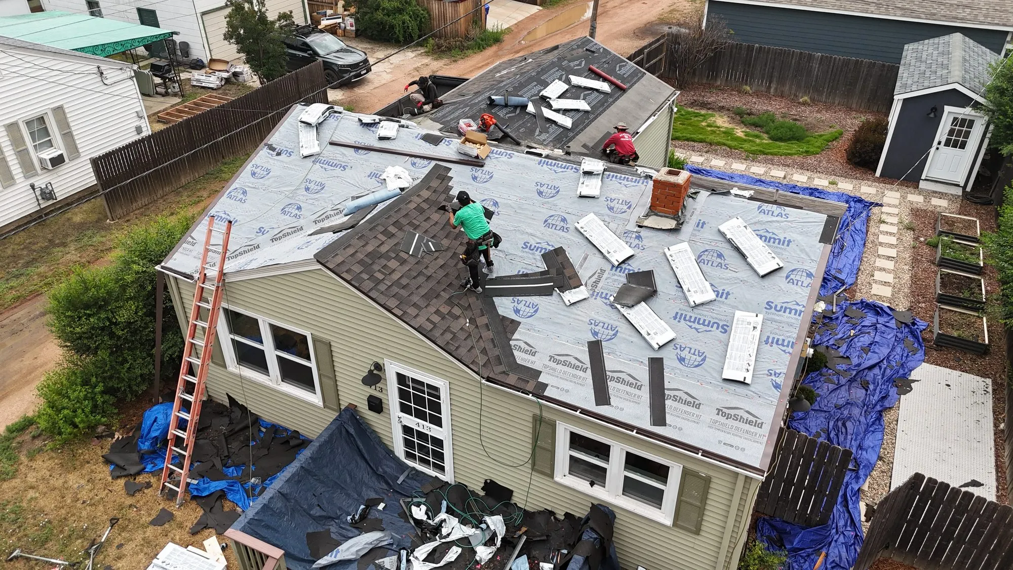 Alta Roofing crew installing a new asphalt shingle roof